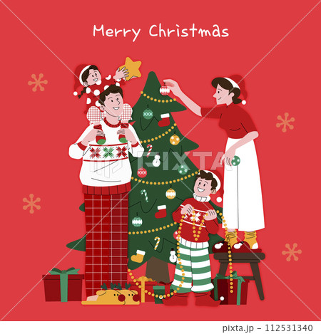 The family is decorating the tree 112531340