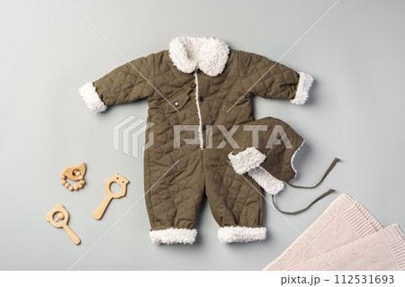 Gray quilted baby overalls for winter flat lay Gray quilted baby overalls for winter flat lay 112531693