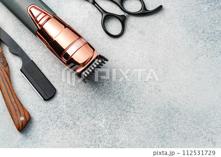 Set of hairdressing instruments on gray background 112531729