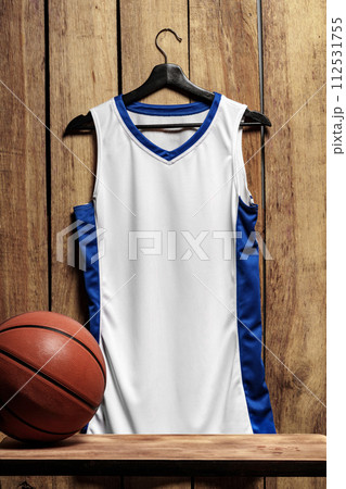 Basketball jersey on hanger against wooden background Basketball jersey on hanger against wooden background 112531755