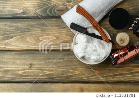 Hairdressing barber tools on wooden background close up Hairdressing barber tools on wooden background close up 112531781