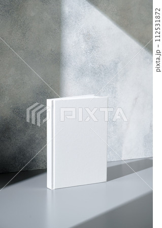 White notepad with hard cover on gray background 112531872