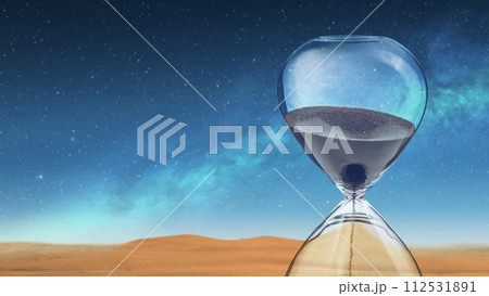 Flowing sand in the hourglass 112531891