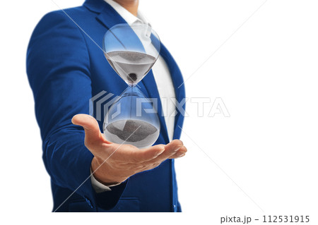 Businessman holding an hourglass isolated on white background. 112531915