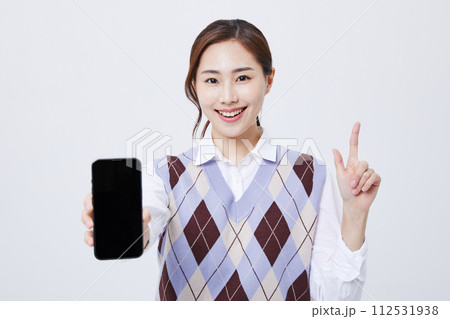 A woman who explains in a chair with her employee ID around her neck A woman who explains in a chair with her employee ID around her neck 112531938