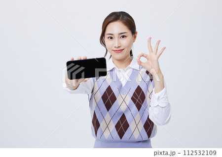 A woman who explains in a chair with her employee ID around her neck A woman who explains in a chair with her employee ID around her neck 112532109