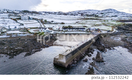 Aerial view of a snow covered Portnoo harbour in County Donegal, Ireland. 112532242