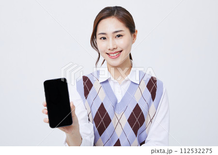 A woman who explains in a chair with her employee ID around her neck 112532275