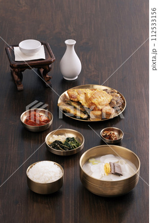 With a wooden table in the background, there's food for New Year's holiday With a wooden table in the background, there's food for New Year's holiday 112533156