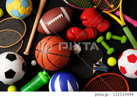 Various sports equipment on black background studio shot 112533494