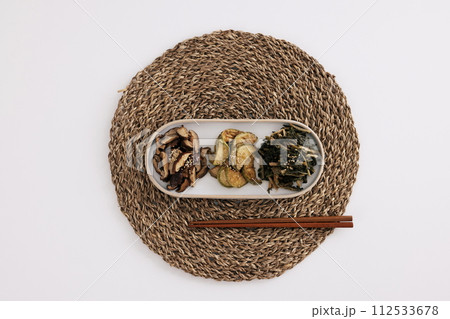 There are mushroom, pumpkin, and dried Siraegi leaf salad on the table mat There are mushroom, pumpkin, and dried Siraegi leaf salad on the table mat 112533678