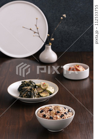 a table of dried greens and five grain rice 112533755