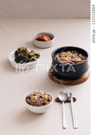 pot rice and several dried vegetables are set up on the table pot rice and several dried vegetables are set up on the table 112533804