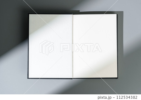 Blank open notepad on gray background studio shot 112534382