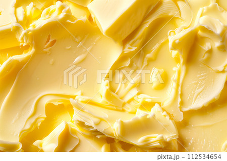Closeup view showcases a yellow texture of creamy butter or margarine as background 112534654