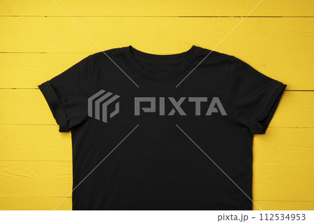 Cotton T-shirt mock up on wooden background flat lay Cotton T-shirt mock up on wooden background flat lay 112534953
