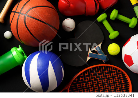 Various sports equipment on black background studio shot Various sports equipment on black background studio shot 112535341