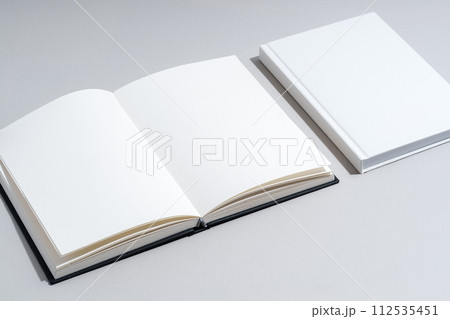 Blank open notepad on gray background studio shot 112535451