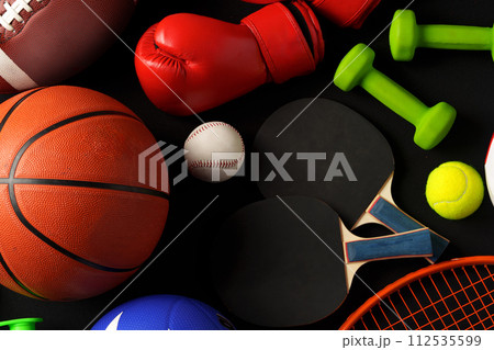 Various sports equipment on black background studio shot 112535599