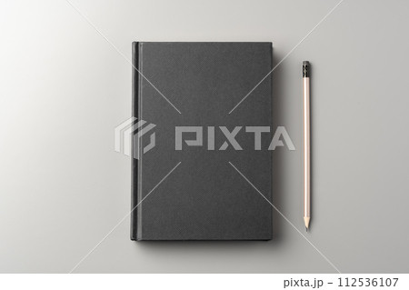 Blank notepad on gray background studio shot 112536107