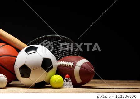 Various sports equipment on black background studio shot Various sports equipment on black background studio shot 112536330