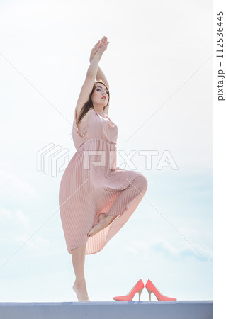 Woman in long dress elegant dress dancing 112536445
