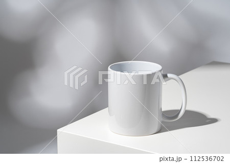 One white mug on gray background with shadow One white mug on gray background with shadow 112536702