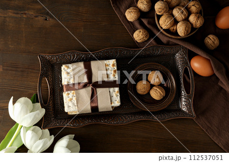 Matzo, nuts, eggs and flower on tray on wooden background, top view Matzo, nuts, eggs and flower on tray on wooden background, top view 112537051