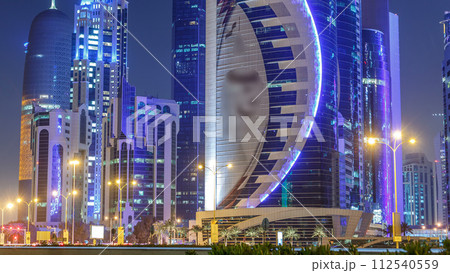 The skyline of Doha by night with starry sky seen from Park timelapse, Qatar 112540559