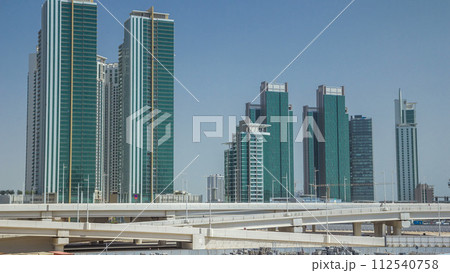 Modern buildings in Abu Dhabi skyline timelapse with operpath. 112540758