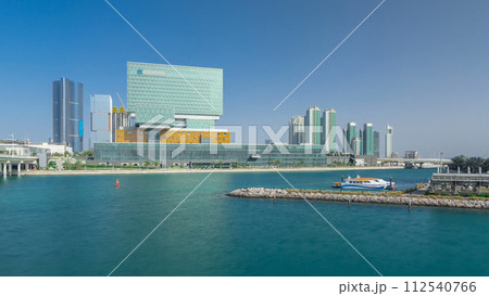 Modern buildings in Abu Dhabi skyline timelapse hyperlapse with waterfront. 112540766