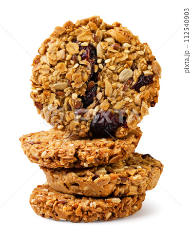 Granola cookies stand on top of each other on a white background. Isolated 112540903