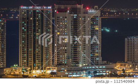 Aerial skyline of Abu Dhabi city centre from above night timelapse Aerial skyline of Abu Dhabi city centre from above night timelapse 112540984