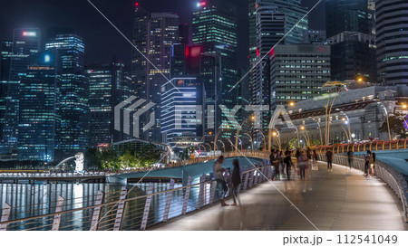 Esplanade bridge and downtown core skyscrapers in the background Singapore night timelapse 112541049