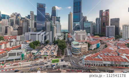 Aerial view of Chinatown with red roofs and Central Business District skyscrapers timelapse, Singapore Aerial view of Chinatown with red roofs and Central Business District skyscrapers timelapse, Singapore 112541178