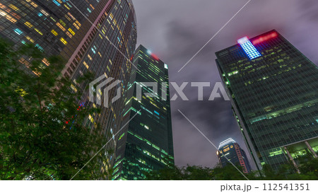 Looking up perspective of modern business skyscrapers glass and sky view landscape of commercial building in central city timelapse hyperlapse 112541351