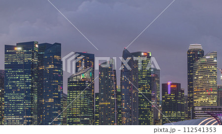 Business Financial Downtown City and Skyscrapers Tower Building at Marina Bay day to night timelapse, Singapore 112541353