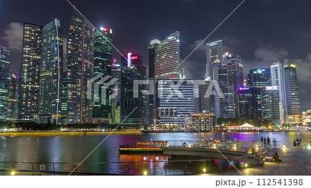Business Financial Downtown City and Skyscrapers Tower Building at Marina Bay night timelapse hyperlapse, Singapore Business Financial Downtown City and Skyscrapers Tower Building at Marina Bay night timelapse hyperlapse, Singapore 112541398