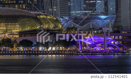 The Esplanade Theatres on the Bay in Singapore at dusk, with beautiful reflection in water night timelapse 112541401