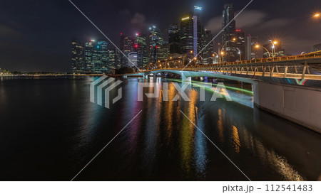 Esplanade bridge and downtown core skyscrapers in the background Singapore night to day timelapse 112541483