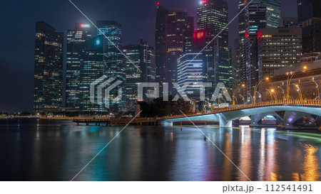 Esplanade bridge and downtown core skyscrapers in the background Singapore night to day timelapse 112541491