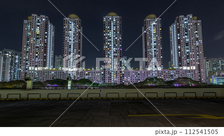 Aerial new estate with neighborhood faculties car park and green garden at the center of Singapore timelapse hyperlapse. Aerial new estate with neighborhood faculties car park and green garden at the center of Singapore timelapse hyperlapse. 112541505