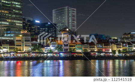 Singapore quay with tall skyscrapers in the central business district on Boat Quay night timelapse hyperlapse Singapore quay with tall skyscrapers in the central business district on Boat Quay night timelapse hyperlapse 112541519