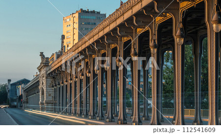 Seine bridge Bir-Hakeim during sunrise timelapse in the center of Paris a beautiful summer morning, Paris, France. Seine bridge Bir-Hakeim during sunrise timelapse in the center of Paris a beautiful summer morning, Paris, France. 112541609