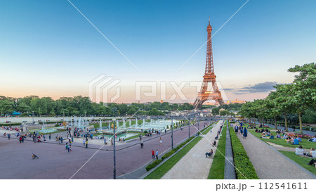 Sunset view of Eiffel Tower timelapse with fountain in Jardins du Trocadero in Paris, France. Sunset view of Eiffel Tower timelapse with fountain in Jardins du Trocadero in Paris, France. 112541611