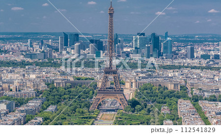 Aerial view from Montparnasse tower with Eiffel tower and La Defense district on background timelapse in Paris, France. 112541829