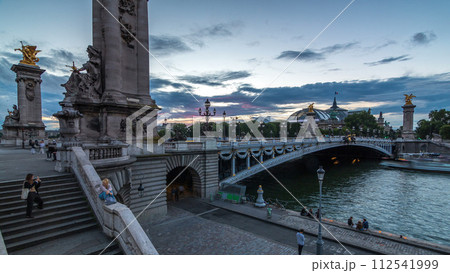 Alexandre Bridge in Paris at night in illumination day to night timelapse. Paris, France 112541999