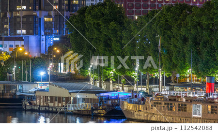 Seine river with ship in Paris at night timelapse, waterfront of the seine river in the city of Paris in france Seine river with ship in Paris at night timelapse, waterfront of the seine river in the city of Paris in france 112542088