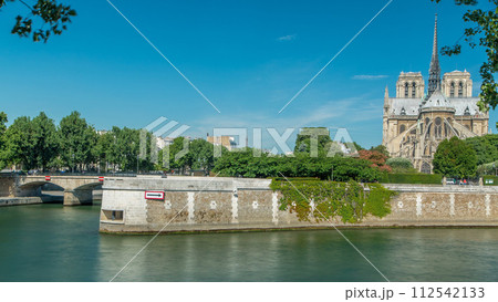 Seine river and Notre Dame de Paris back side timelapse. Famous symbols of Paris 112542133
