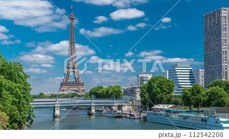 Eiffel tower at the river Seine timelapse from bridge in Paris, France 112542208